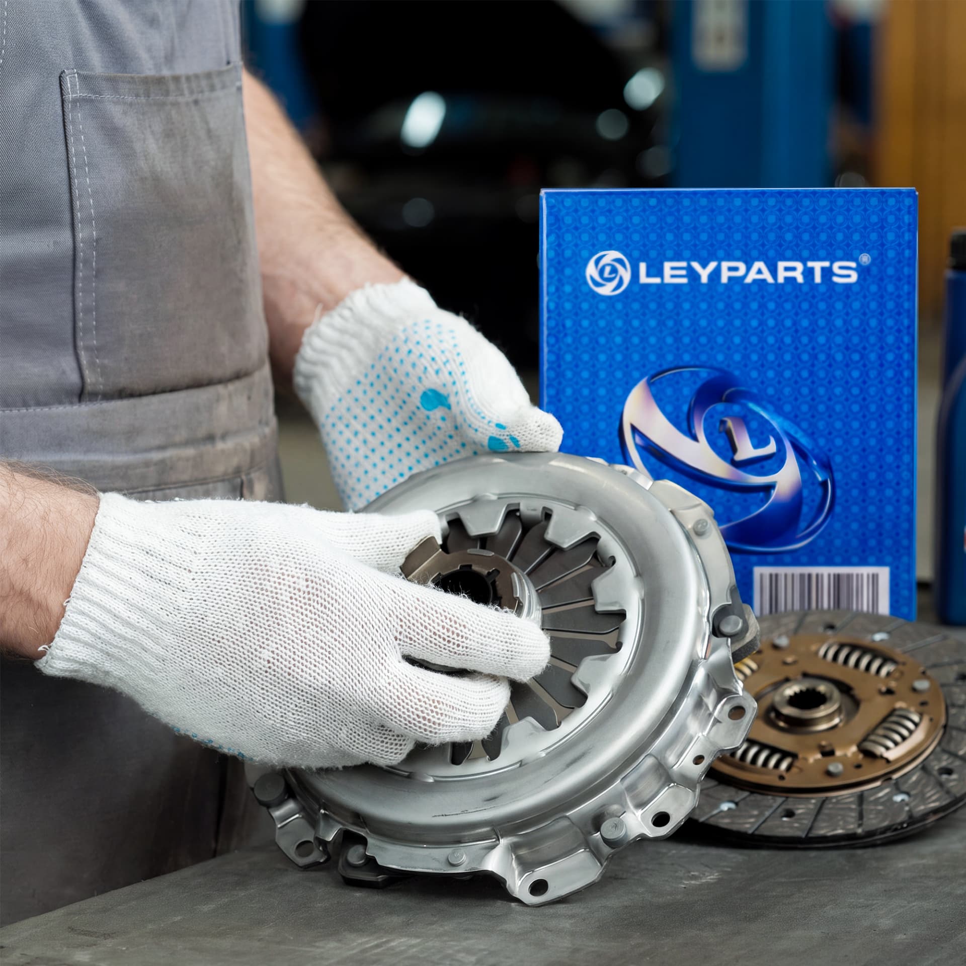 Technician handling a genuine Leyparts clutch assembly